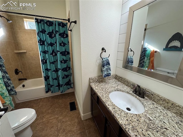 bathroom with shower / bath combo, baseboards, toilet, tile patterned floors, and vanity