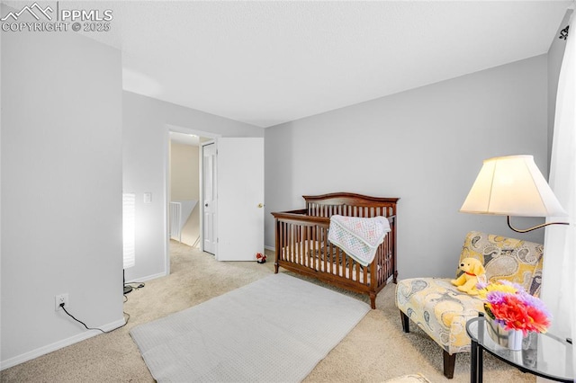 bedroom with carpet floors, visible vents, and baseboards