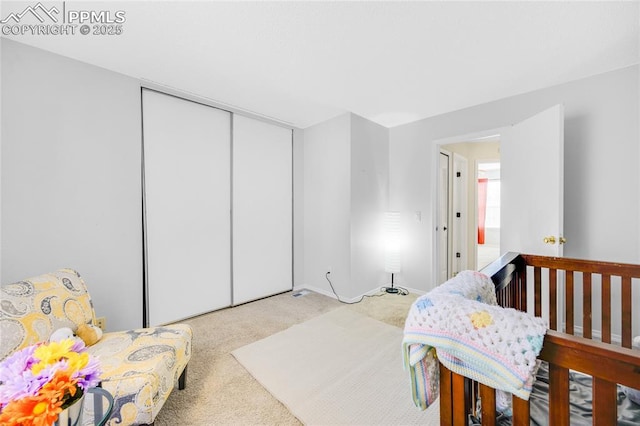 bedroom with carpet floors and a closet