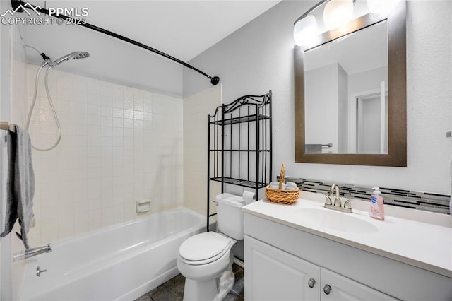 bathroom featuring toilet, bathtub / shower combination, and vanity