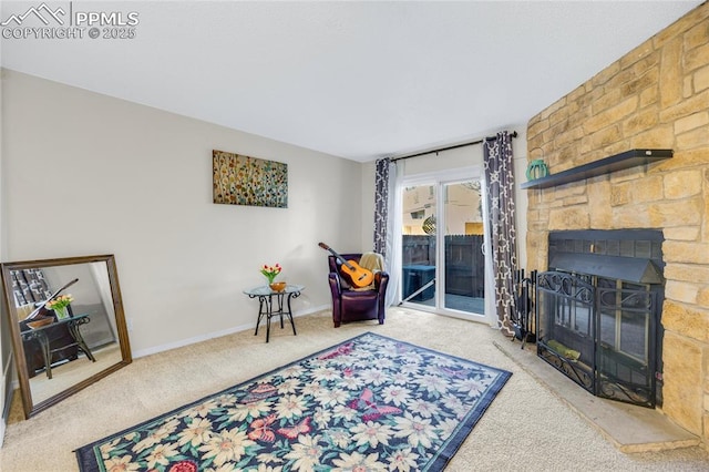 sitting room featuring a fireplace, baseboards, and carpet flooring