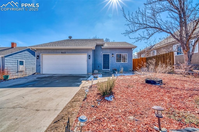 ranch-style home with a garage, concrete driveway, roof with shingles, fence, and stucco siding