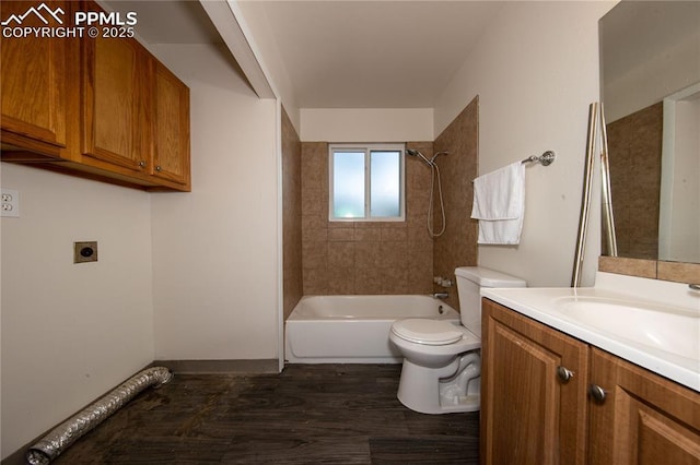 full bath featuring toilet, bathing tub / shower combination, wood finished floors, and vanity