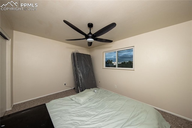 bedroom with a ceiling fan, baseboards, and carpet flooring