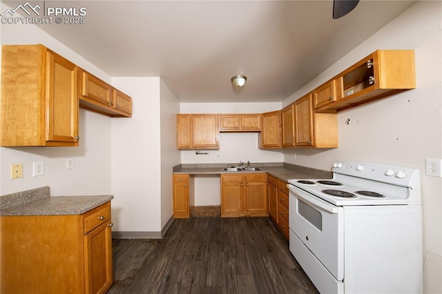 kitchen featuring dark wood-type flooring, a sink, baseboards, brown cabinetry, and white electric range oven