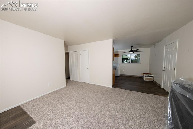 interior space with carpet floors and baseboards