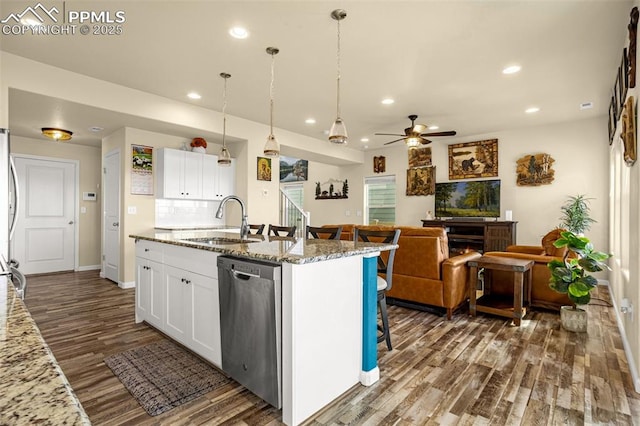 kitchen featuring recessed lighting, a sink, white cabinetry, dishwasher, and dark wood finished floors