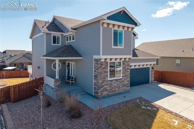 craftsman house with a garage, a shingled roof, fence, concrete driveway, and stone siding