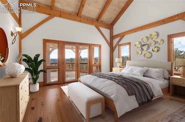 bedroom featuring beam ceiling, french doors, wood finished floors, high vaulted ceiling, and access to outside