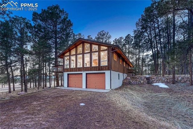 exterior space featuring a garage and driveway