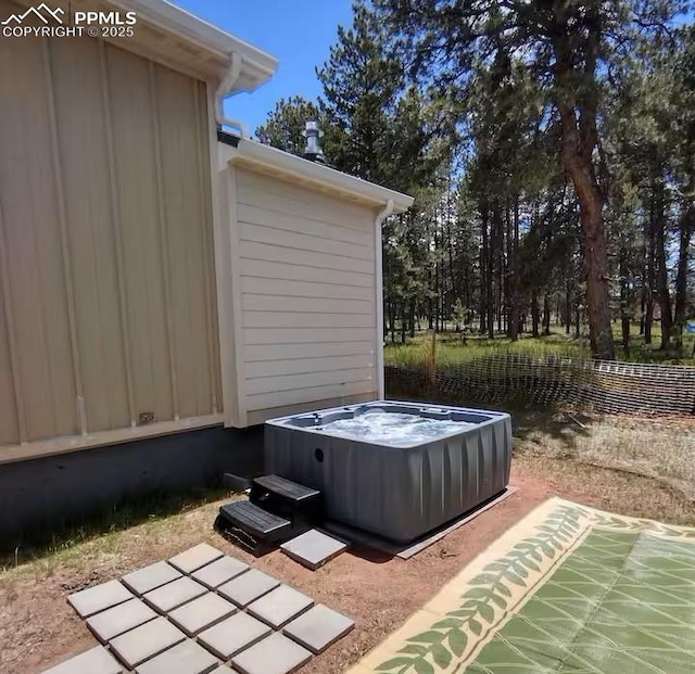 view of patio with a hot tub