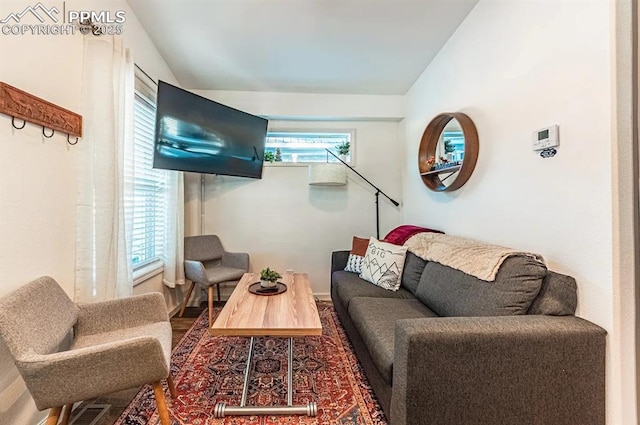 living room with lofted ceiling and visible vents