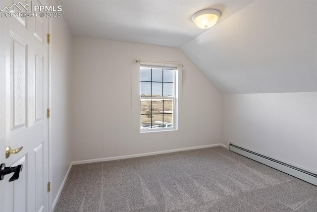 additional living space with carpet floors, baseboards, baseboard heating, and lofted ceiling