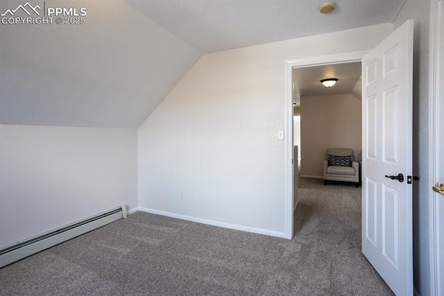 bonus room with vaulted ceiling, baseboard heating, carpet, and baseboards