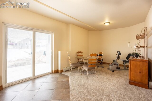 recreation room with tile patterned flooring and baseboards