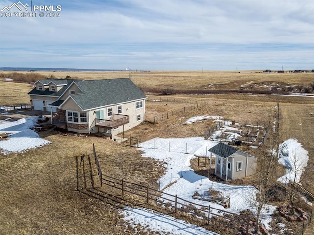 snowy aerial view with a rural view