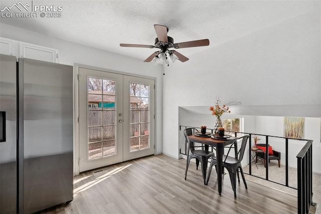 dining room with french doors and wood finished floors