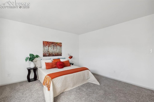 carpeted bedroom featuring baseboards