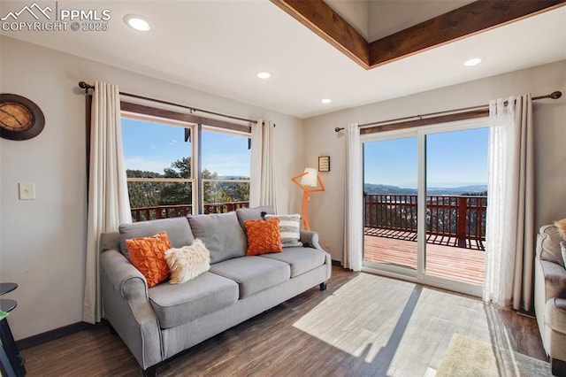 living area with recessed lighting, wood finished floors, and baseboards