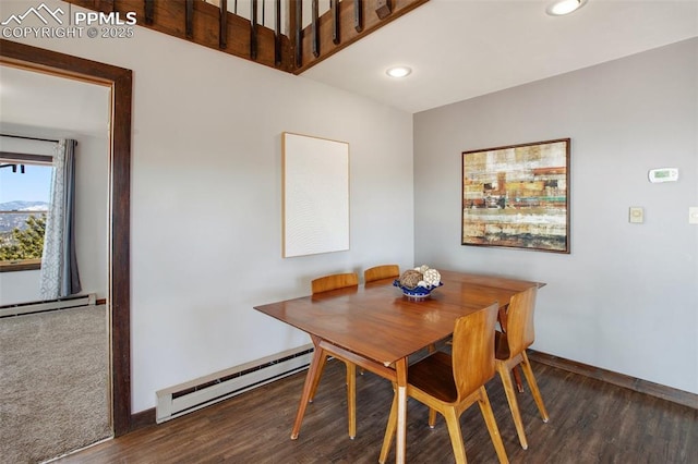 dining area with a baseboard radiator, recessed lighting, baseboards, and wood finished floors