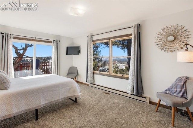 bedroom featuring carpet, a baseboard radiator, and baseboards