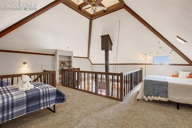 bedroom featuring high vaulted ceiling, carpet flooring, and beamed ceiling