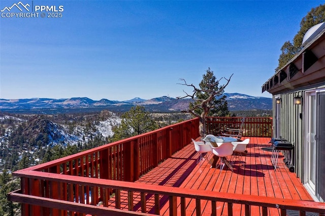 wooden terrace with a mountain view