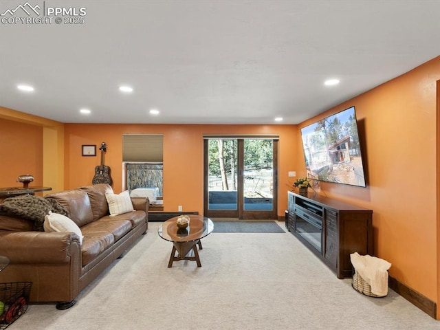 living area with baseboards, carpet floors, and recessed lighting