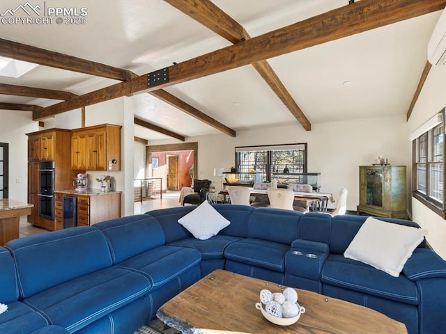 living area with lofted ceiling with beams and plenty of natural light