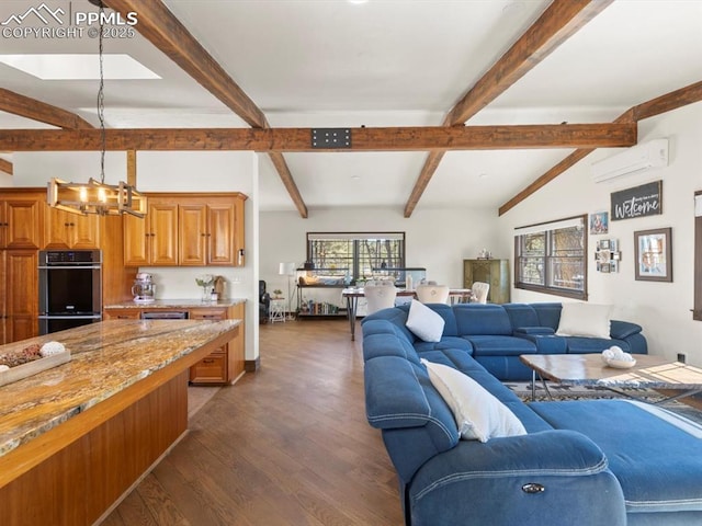 living room with dark wood-style floors, a chandelier, lofted ceiling with beams, and a wall mounted AC