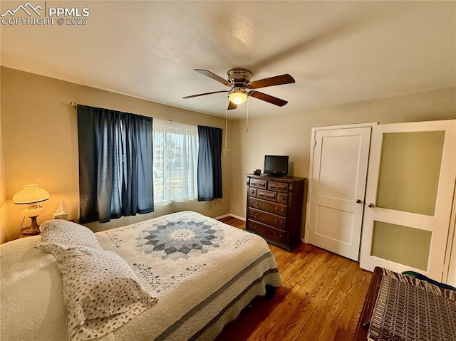 bedroom featuring ceiling fan and wood finished floors