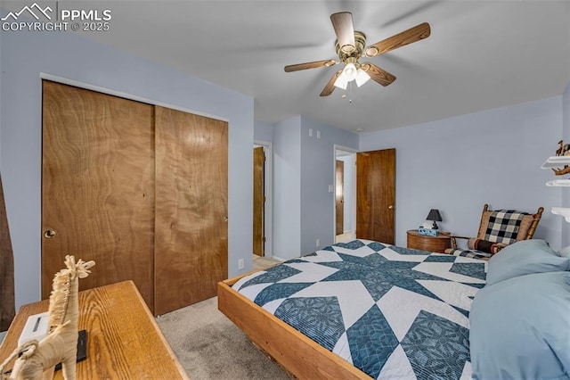 bedroom featuring carpet floors, a closet, and a ceiling fan