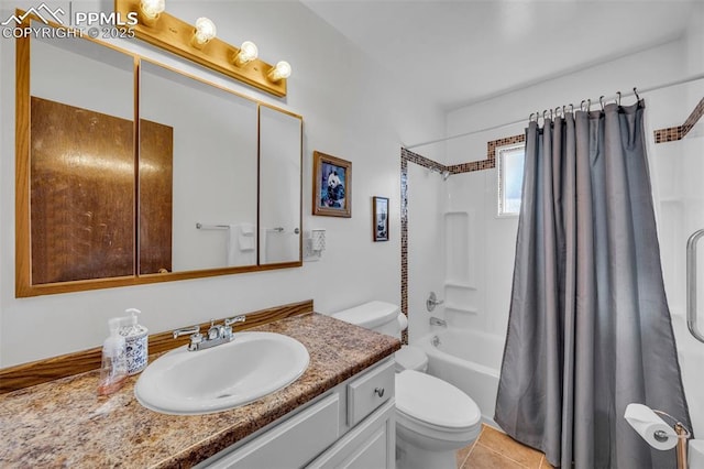 bathroom featuring toilet, tile patterned floors, shower / bath combo, and vanity