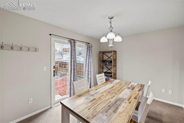 unfurnished dining area with carpet floors and baseboards