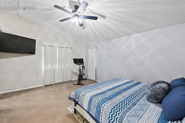 carpeted bedroom with lofted ceiling, ceiling fan, and baseboards