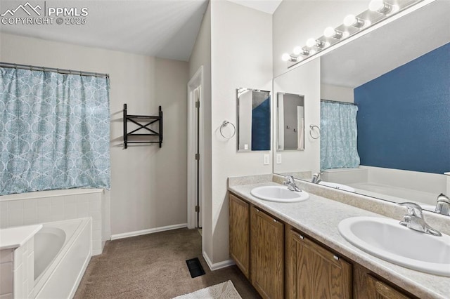 bathroom with double vanity, a sink, and a bath