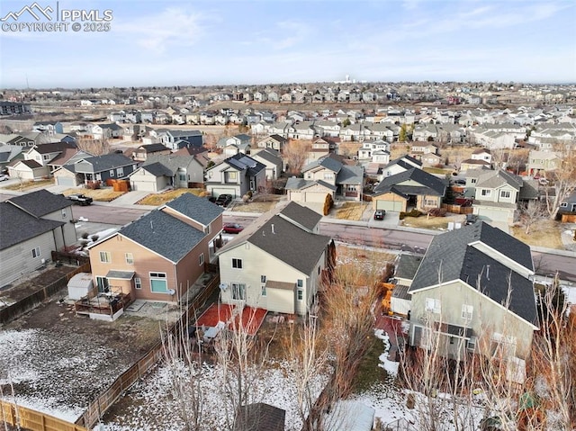 birds eye view of property with a residential view