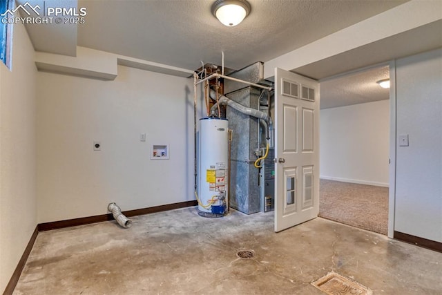 finished basement featuring gas water heater, a textured ceiling, and baseboards