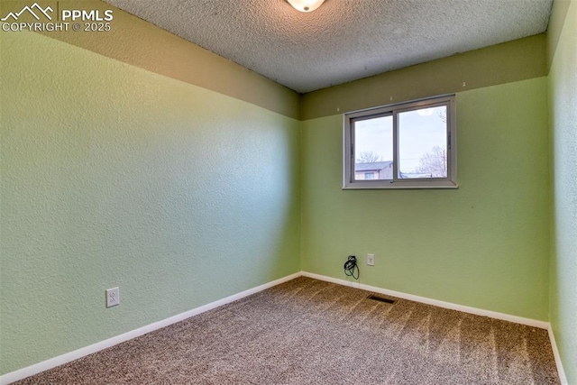 unfurnished room featuring baseboards, visible vents, a textured wall, a textured ceiling, and carpet floors