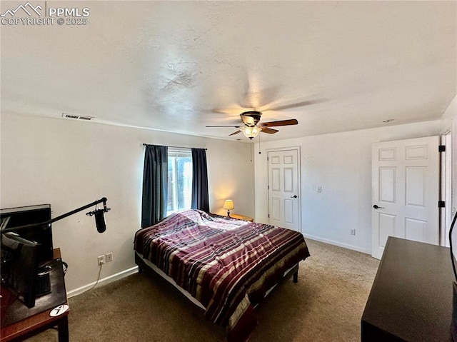 bedroom featuring carpet floors, a ceiling fan, visible vents, and baseboards