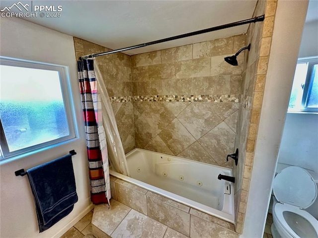 bathroom with a combined bath / shower with jetted tub