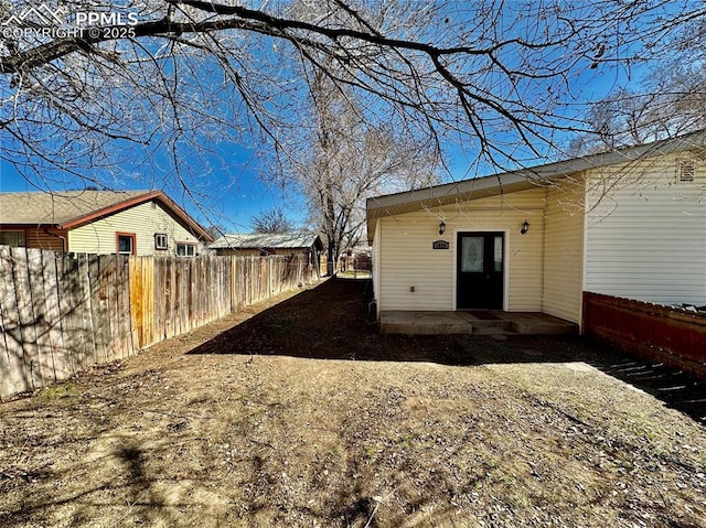 exterior space with fence and a patio