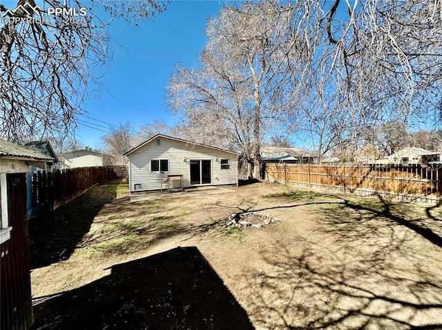 back of property featuring a patio area and a fenced backyard