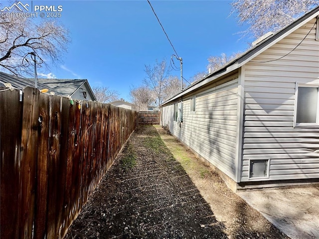 view of property exterior with fence private yard