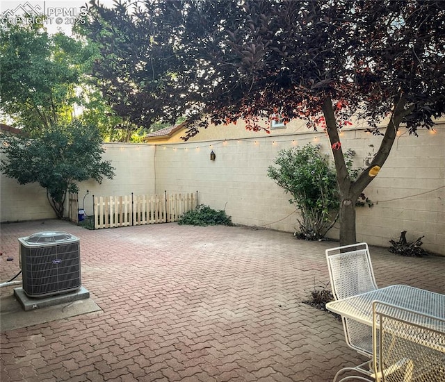 view of patio / terrace featuring central AC and a fenced backyard