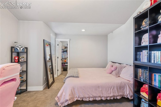 bedroom featuring carpet flooring and baseboards