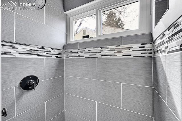 bathroom with tiled shower