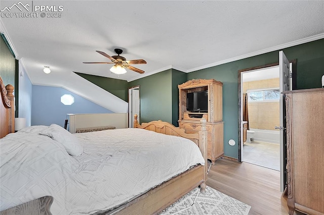 bedroom with connected bathroom, crown molding, ceiling fan, wood finished floors, and a textured ceiling