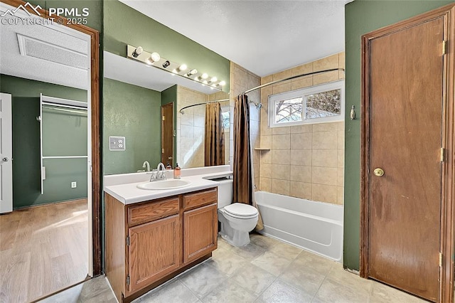 bathroom featuring vanity, toilet, and shower / bathtub combination with curtain