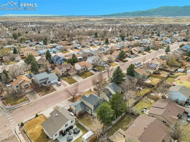 birds eye view of property featuring a mountain view and a residential view